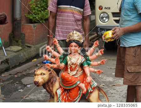 Final Touches on a Small Home Durga Idol Before Pandal Setup 128335065