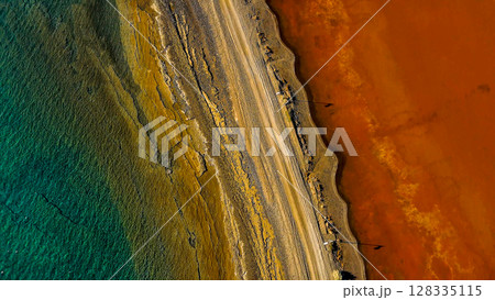 Red salt sea lake, at winter, village Alyki, Boeotia, Greece. Red salt sea lake, at winter, village Alyki, Boeotia, Greece. 128335115