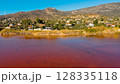 Red salt sea lake, at winter, village Alyki, Boeotia, Greece. 128335118