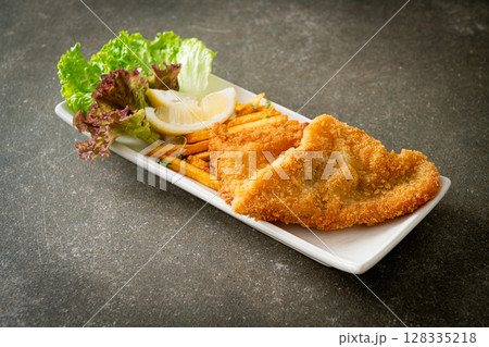 fish and chips - fried fish fillet with potatoes chips 128335218