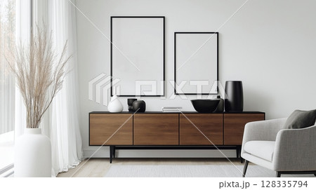 blank white picture frame hanging on a wooden shelf against a white wall. The frame is rectangular in shape and has a black border.	 128335794