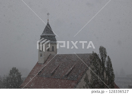 A church steeple covered in snow 128336527