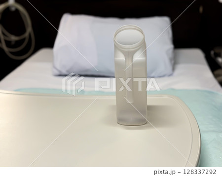 Plastic Urinal on Overbed Table in Hospital Room Plastic Urinal on Overbed Table in Hospital Room 128337292