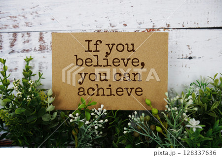 If you believe, You can achieve text message motivational and inspiration quote top view on wooden background 128337636