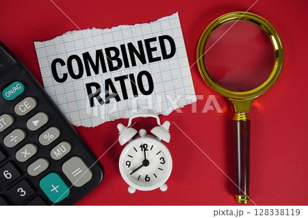 Combined Ratio text with alarm clock, magnifying glass anc calculator on red background Combined Ratio text with alarm clock, magnifying glass anc calculator on red background 128338119