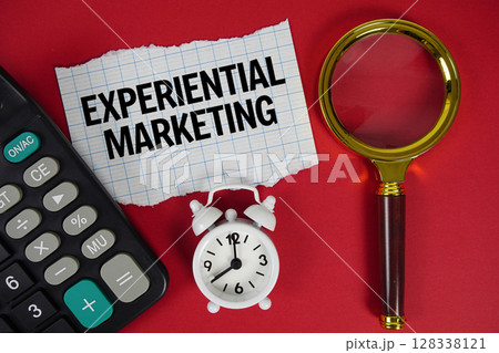 Experiential Marketing text with alarm clock, magnifying glass anc calculator on red background Experiential Marketing text with alarm clock, magnifying glass anc calculator on red background 128338121