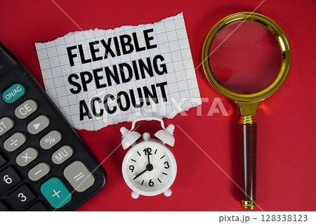 Flexible Spending Account text with alarm clock, magnifying glass anc calculator on red background Flexible Spending Account text with alarm clock, magnifying glass anc calculator on red background 128338123