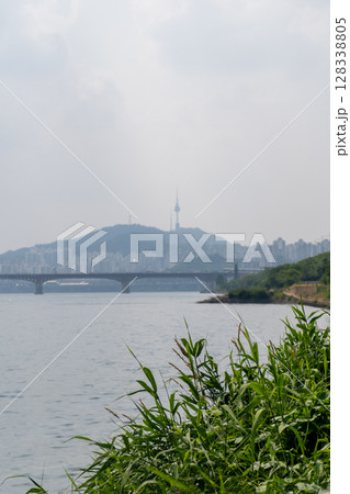 View of N Seoul Tower with Seongsu Bridge and Han river on the fore ground, in Seoul, South Korea 128338805