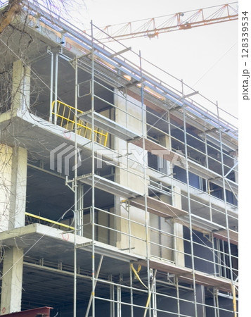 Photo of the building construction process during the day 128339534