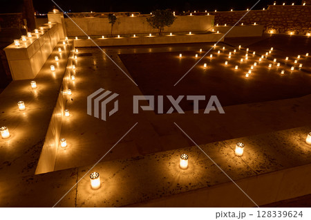 Illuminated Pathway Decorated with Candle Lanterns at Night Illuminated Pathway Decorated with Candle Lanterns at Night 128339624