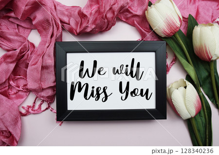 We will Miss You text with flowers decoration on light pink background 128340236