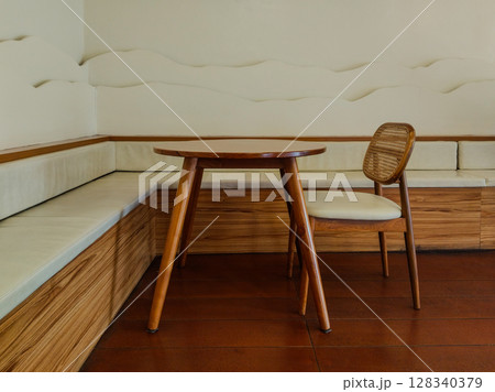 Stylish empty decorative cafe room with wooden set of table and chair 128340379