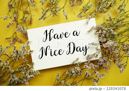 Have a Nice Day text with flowers decoration on yellow background Have a Nice Day text with flowers decoration on yellow background 128341078