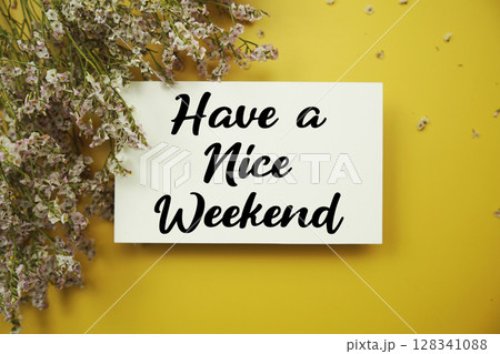 Have a Nice Weekend text with flowers decoration on yellow background Have a Nice Weekend text with flowers decoration on yellow background 128341088