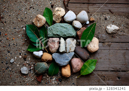 nature inspired design of leaves and stones forming human face, crafted harmony 128341241