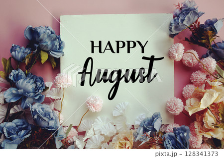 Happy August text with flowers decorations on pink background Happy August text with flowers decorations on pink background 128341373