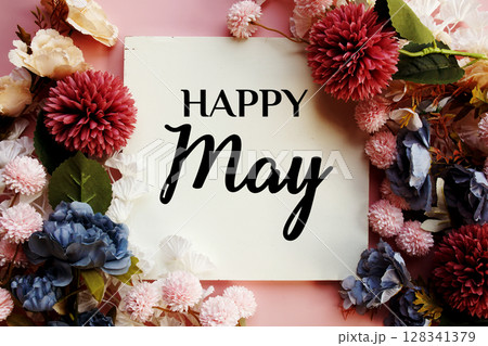 Happy May text with flowers decorations on pink background Happy May text with flowers decorations on pink background 128341379