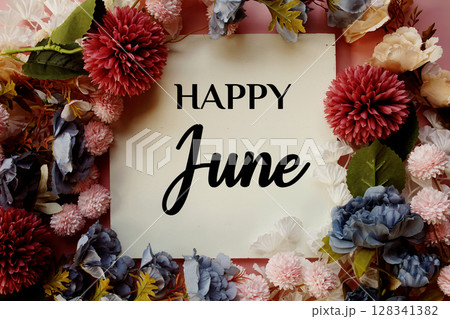 Happy June text with flowers decorations on pink background Happy June text with flowers decorations on pink background 128341382