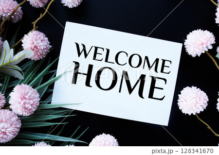 Welcome Home text with flowers decorations on black background 128341670