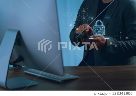 Data protection privacy person business suit using smartphone with digital lock icons and security graphics overlayed, indicating cybersecurity 128341906