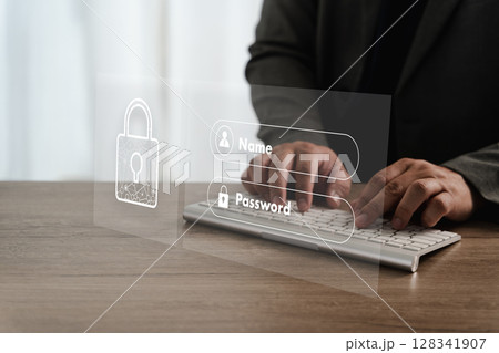 Cybersecurity Data privacy Person entering login details transparent digital interface with security icons, symbolizing online security and data 128341907
