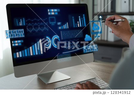 Business intelligence Person analyzing data computer screen with graphs and cloud icons, indicating data analysis and technology use professional 128341912