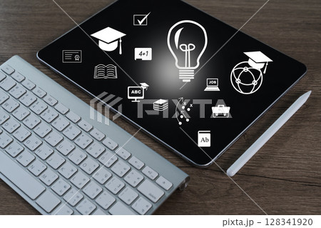 Student success tablet with educational icons and stylus wooden surface, representing learning and innovation, evokes creativity and knowledge 128341920