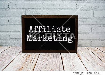Affiliate Marketing text written on chalkboard standing on wooden background Affiliate Marketing text written on chalkboard standing on wooden background 128342338