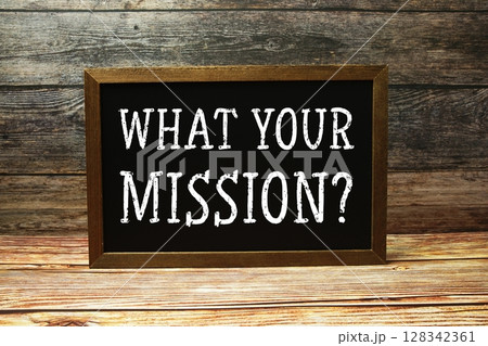 What your mission? text with blackboard on wooden background What your mission? text with blackboard on wooden background 128342361