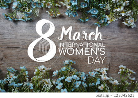 8 March International Women's Day text message with flowers decoration on wooden background 8 March International Women's Day text message with flowers decoration on wooden background 128342623