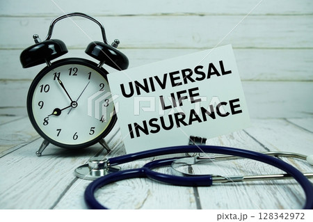 Universal Life Insurance text on paper card with alarm clock and stethoscope on wooden background Universal Life Insurance text on paper card with alarm clock and stethoscope on wooden background 128342972