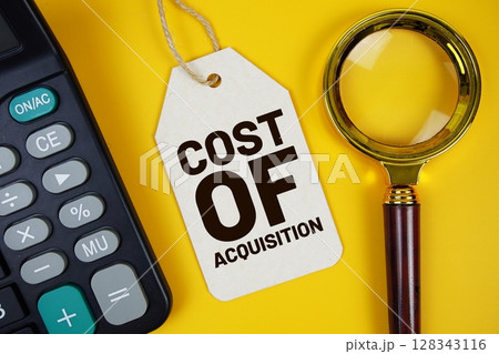 Cost Of Acquisition text on price tag with magnifying glass and calculator on yellow background 128343116