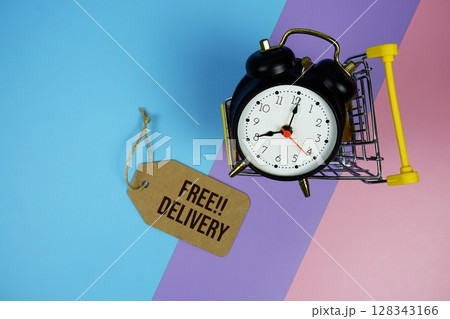 Free Delivery text on price tag with alarm clock and trolley shopping cart on pink, purple, blue geometric background Free Delivery text on price tag with alarm clock and trolley shopping cart on pink, purple, blue geometric background 128343166