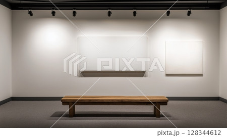 empty room with white walls and a wooden bench in the center. The bench is made of wood and has a rectangular shape with a flat top	 128344612