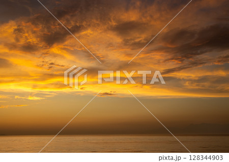 Cloudy summer sunset, Acharavi, Corfu, Greece 128344903