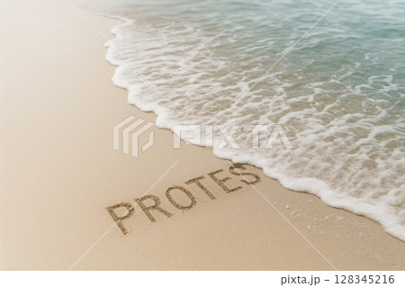 The word PROTEST is washed away by a sea wave on the sand. Space for text. 128345216