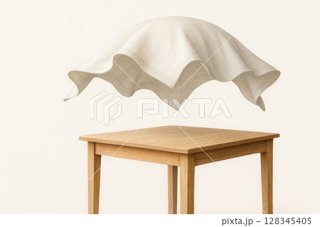 A floating tablecloth over a wooden table. A floating tablecloth over a wooden table. 128345405