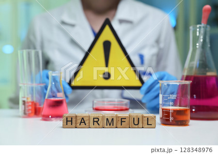 Caution There are dangerous and harmful chemicals present in the laboratory setting 128348976