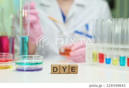 Conducting a Chemical Dye Experiment in a Laboratory with Various Colorful Solutions and Samples 128349641