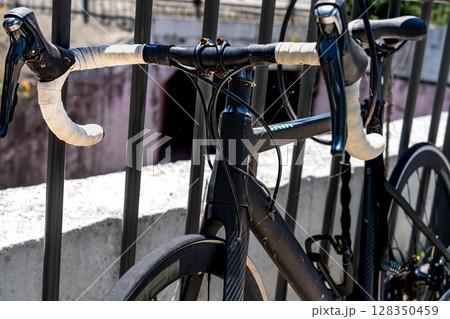 Abandoned bicycle. Spider web on the handlebar of an abandoned bicycle. Abandoned bicycle. Spider web on the handlebar of an abandoned bicycle. 128350459