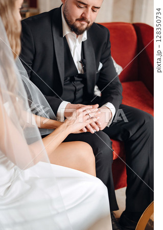 happy bride and groom in the lobby of the hotel on the day of the wedding happy bride and groom in the lobby of the hotel on the day of the wedding 128350734