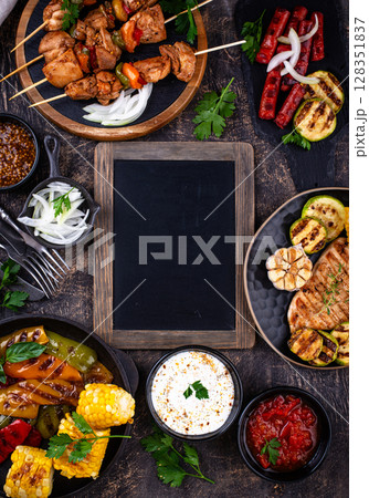 Assortment of grilled bbq meat and vegetables Assortment of grilled bbq meat and vegetables 128351837