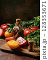Fresh Vegetables Oil Bottle Wooden Board 128353671