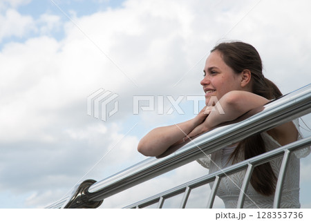 Young girl looking to the sky Young girl looking to the sky 128353736