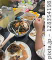 Table full of delicious seafood, including crabs, mussels, and noodles. 128354198