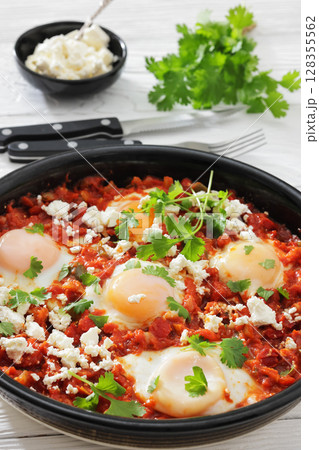 shakshuka, eggs poached in tomato vegetable sauce shakshuka, eggs poached in tomato vegetable sauce 128355562