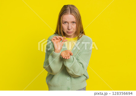 Woman show a little bit gesture begging help need some more please give me measuring small size 128356694