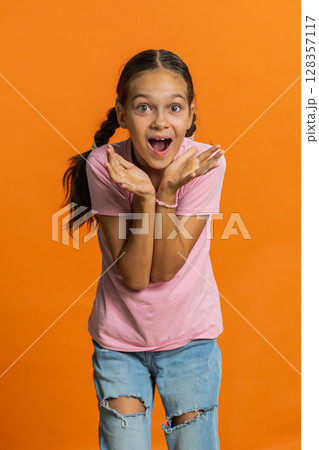 Excited child girl kid surprised, shocked by sudden victory, good win news celebrating, wow reaction 128357117