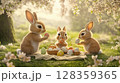 Three adorable rabbits gather around a picnic blanket under blooming trees, happily painting colorful Easter eggs. The sun shines softly, creating a joyful atmosphere filled with spring vibes. 128359365