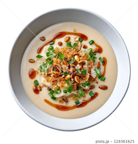 Creamy Celery Root Veloute Soup Topped with Celery Ribbons, Walnut Oil Drizzle and Toasted Pumpkin Seeds Creamy Celery Root Veloute Soup Topped with Celery Ribbons, Walnut Oil Drizzle and Toasted Pumpkin Seeds 128361625